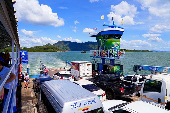 Vehicles aboard a ferry crossing the Andaman Sea between Koh Lanta Noi and Koh Lanta Yai, Thailand.