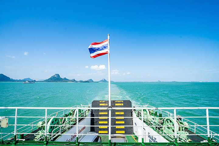 The Thai national flag flutters on the deck of a Raja Ferry en route from Koh Samui to Donsak.